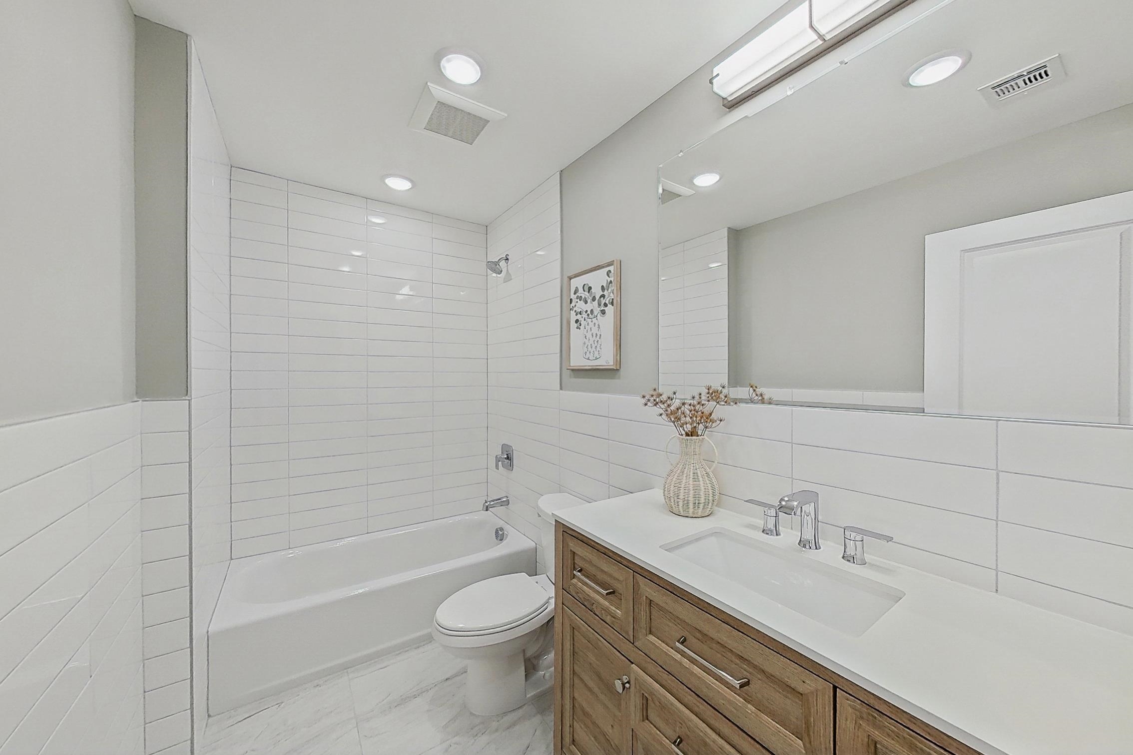 261 Winans Avenue Hillside, NJ 07205 - Photo 42 of 48 a bathroom with a granite countertop sink a toilet and shower