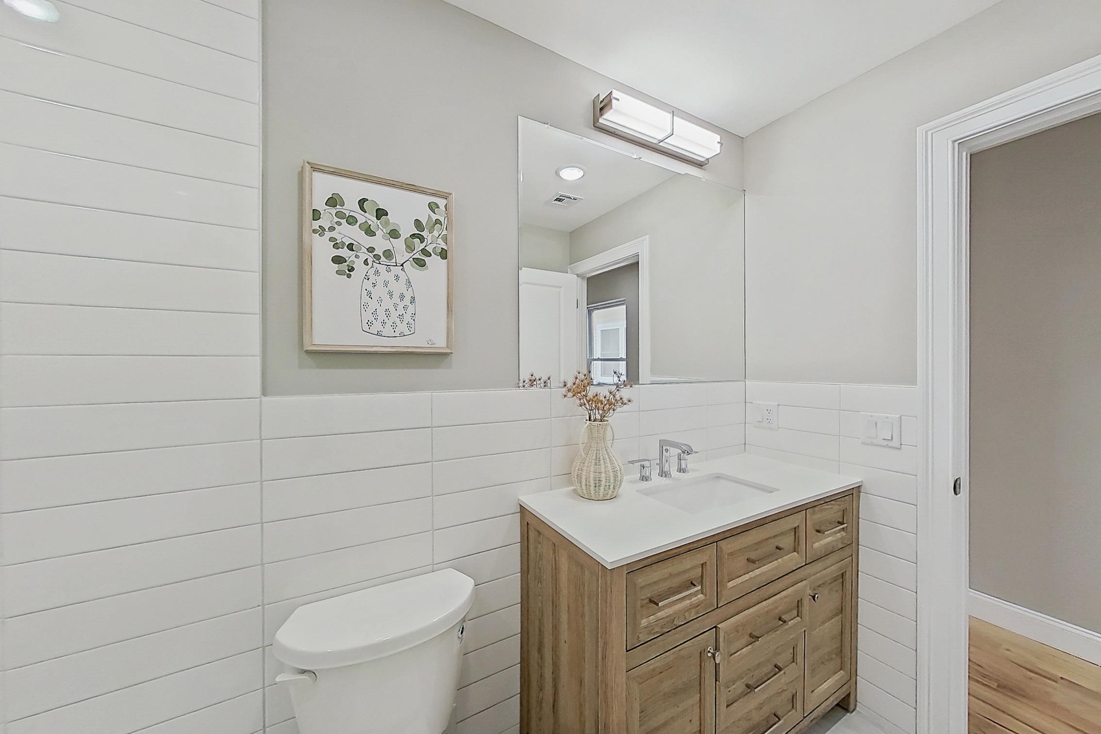 261 Winans Avenue Hillside, NJ 07205 - Photo 43 of 48 a bathroom with a toilet sink and mirror