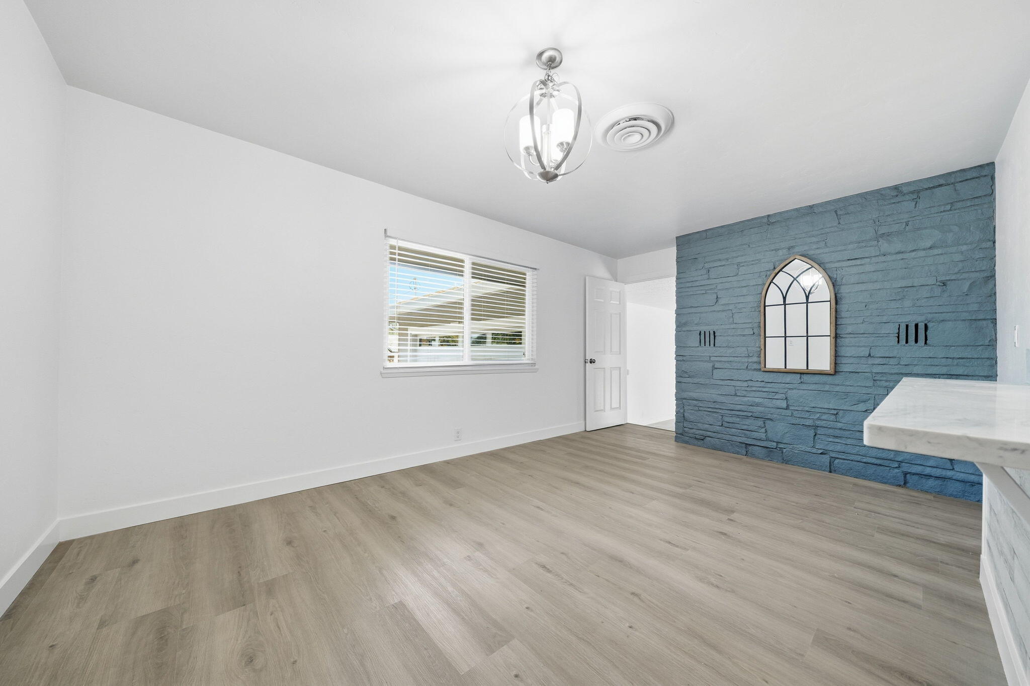 3911 Roesner Avenue Redding, CA 96002 - Photo 14 of 42 wooden floor in an empty room with a window