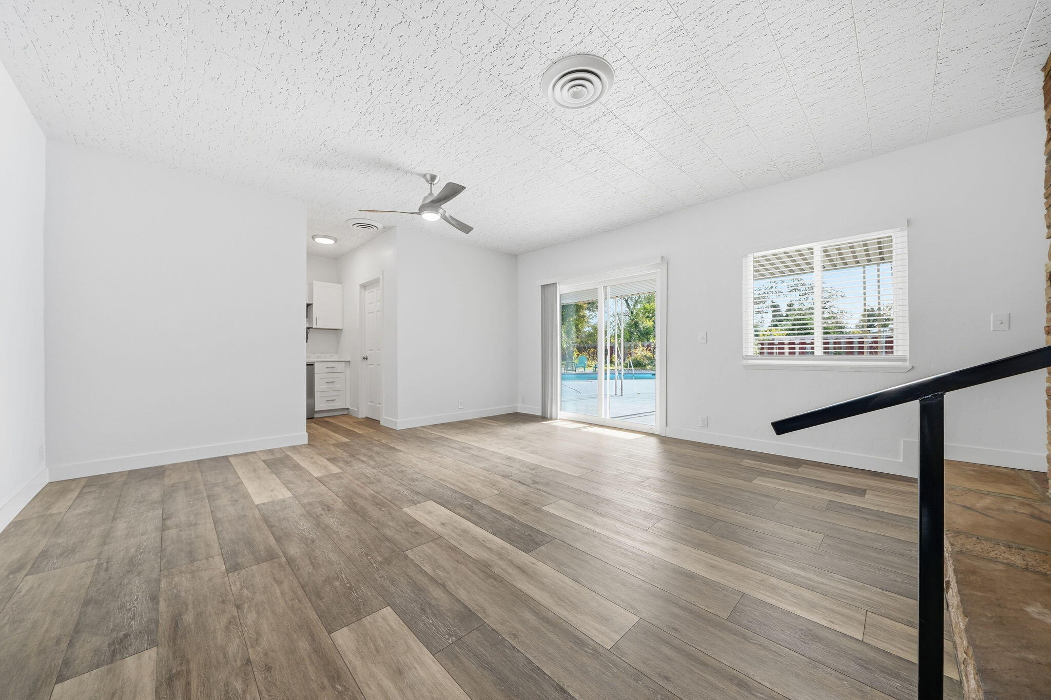 3911 Roesner Avenue Redding, CA 96002 - Photo 16 of 42 wooden floor in an empty room with a window