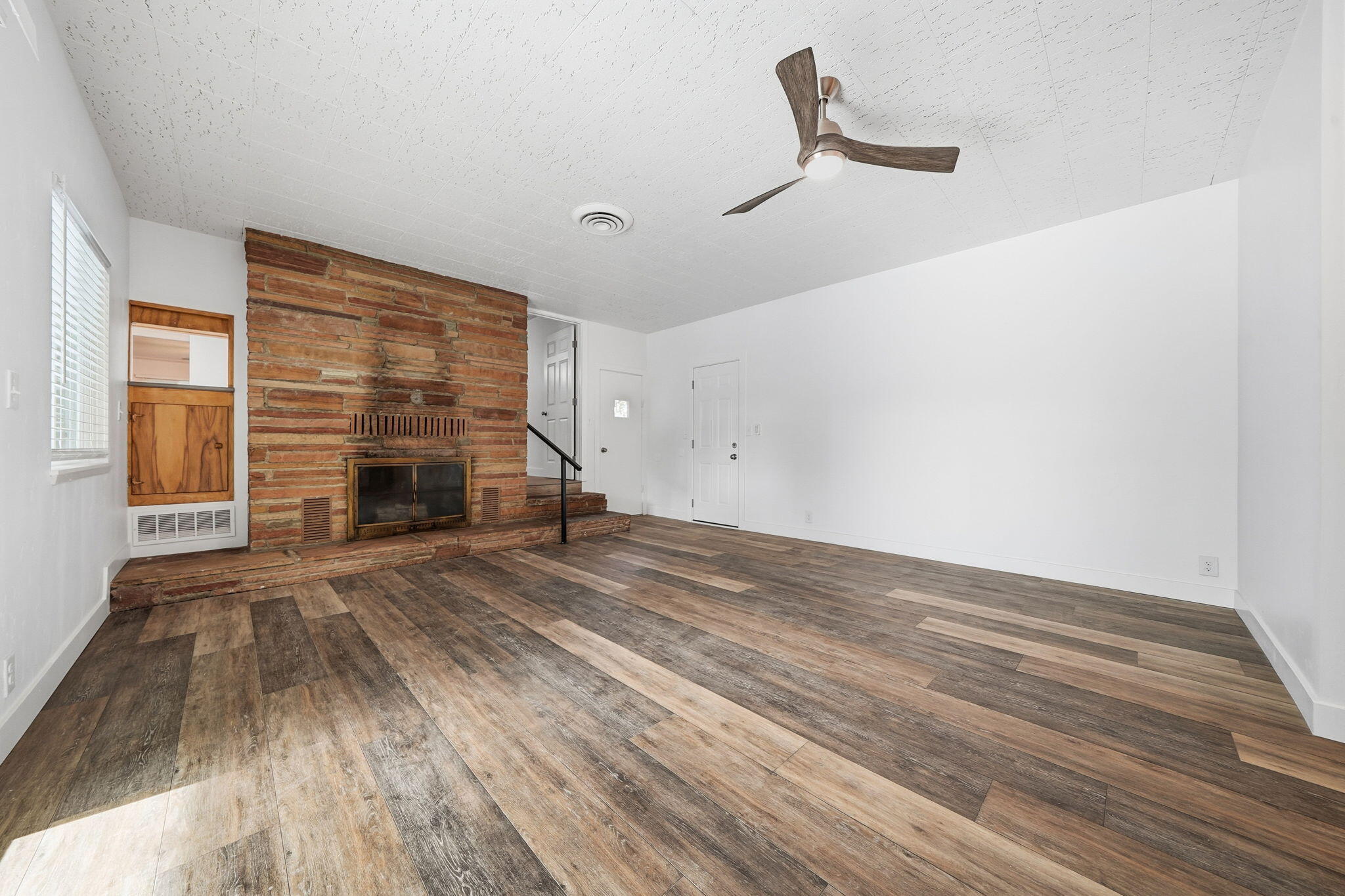 3911 Roesner Avenue Redding, CA 96002 - Photo 17 of 42 a view of empty room with wooden floor and fan