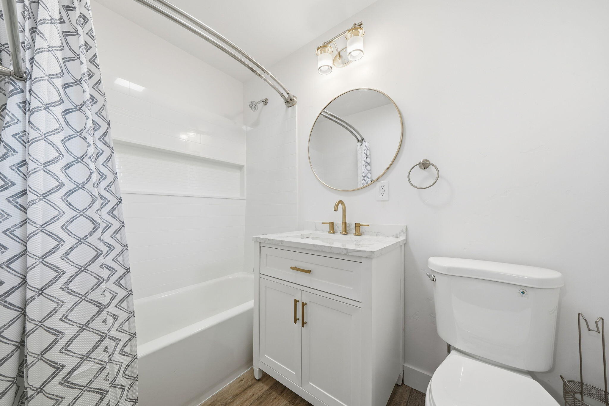 3911 Roesner Avenue Redding, CA 96002 - Photo 20 of 42 a bathroom with a toilet sink vanity tub and mirror