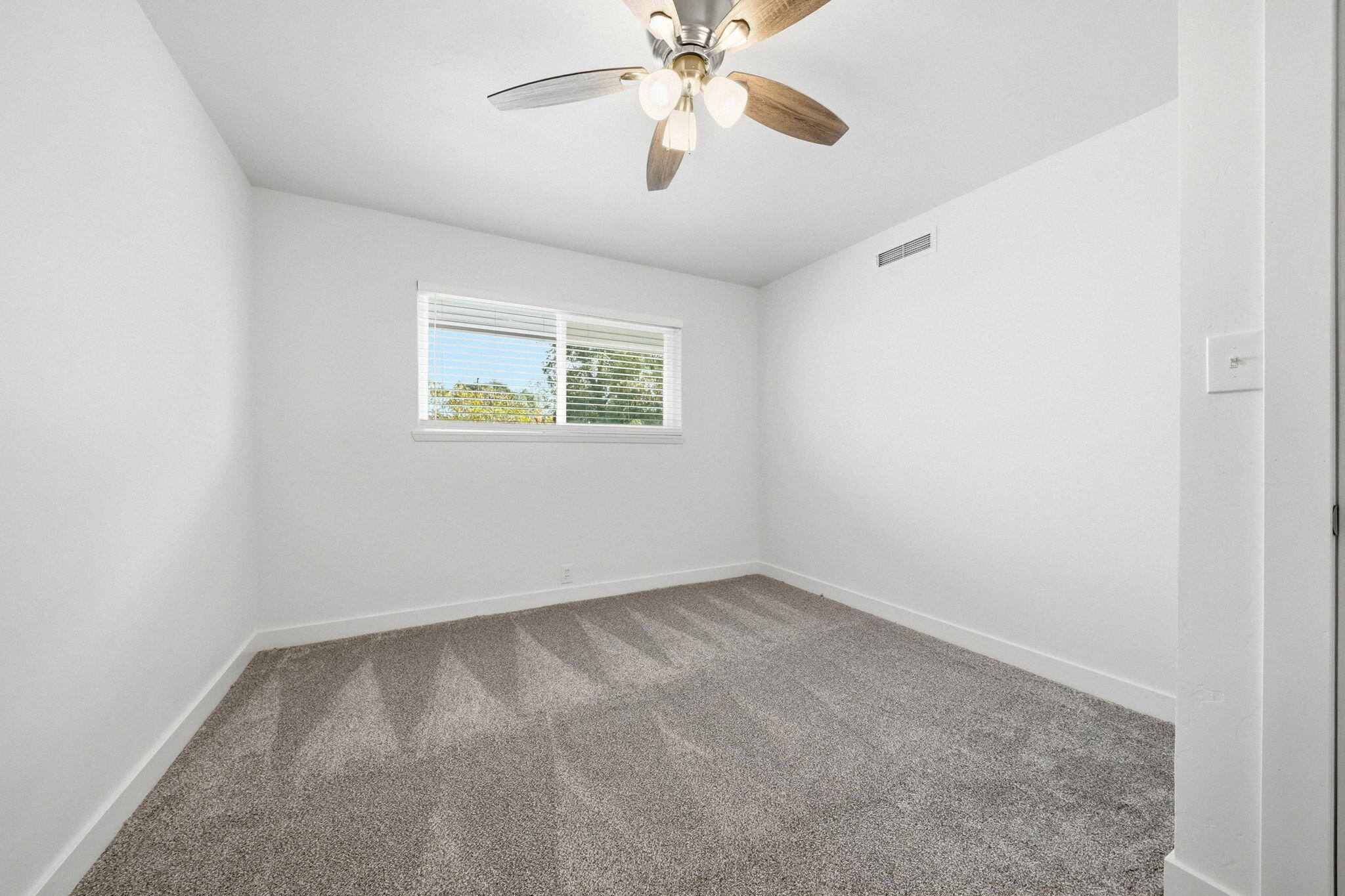 3911 Roesner Avenue Redding, CA 96002 - Photo 28 of 42 an empty room with a window and a fan