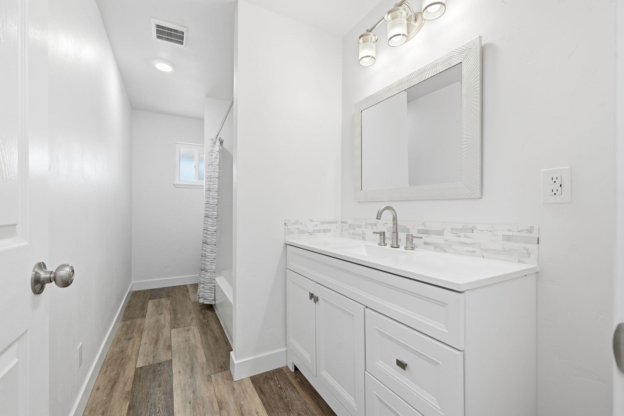 3911 Roesner Avenue Redding, CA 96002 - Photo 29 of 42 a bathroom with a sink and a mirror