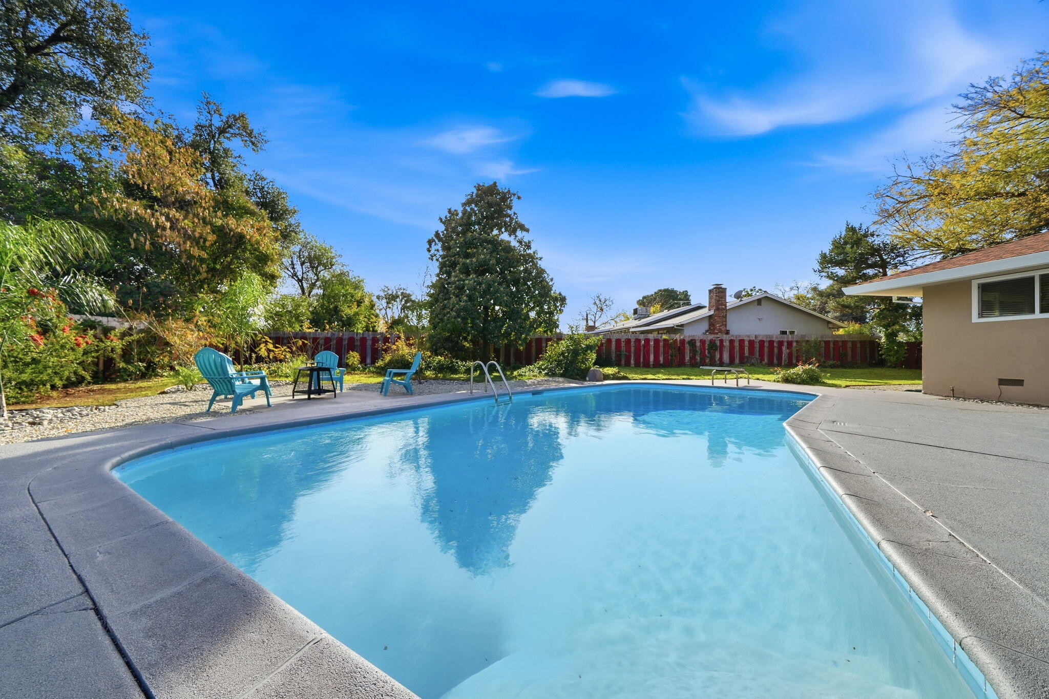 3911 Roesner Avenue Redding, CA 96002 - Photo 36 of 42 a view of a swimming pool with a lake view