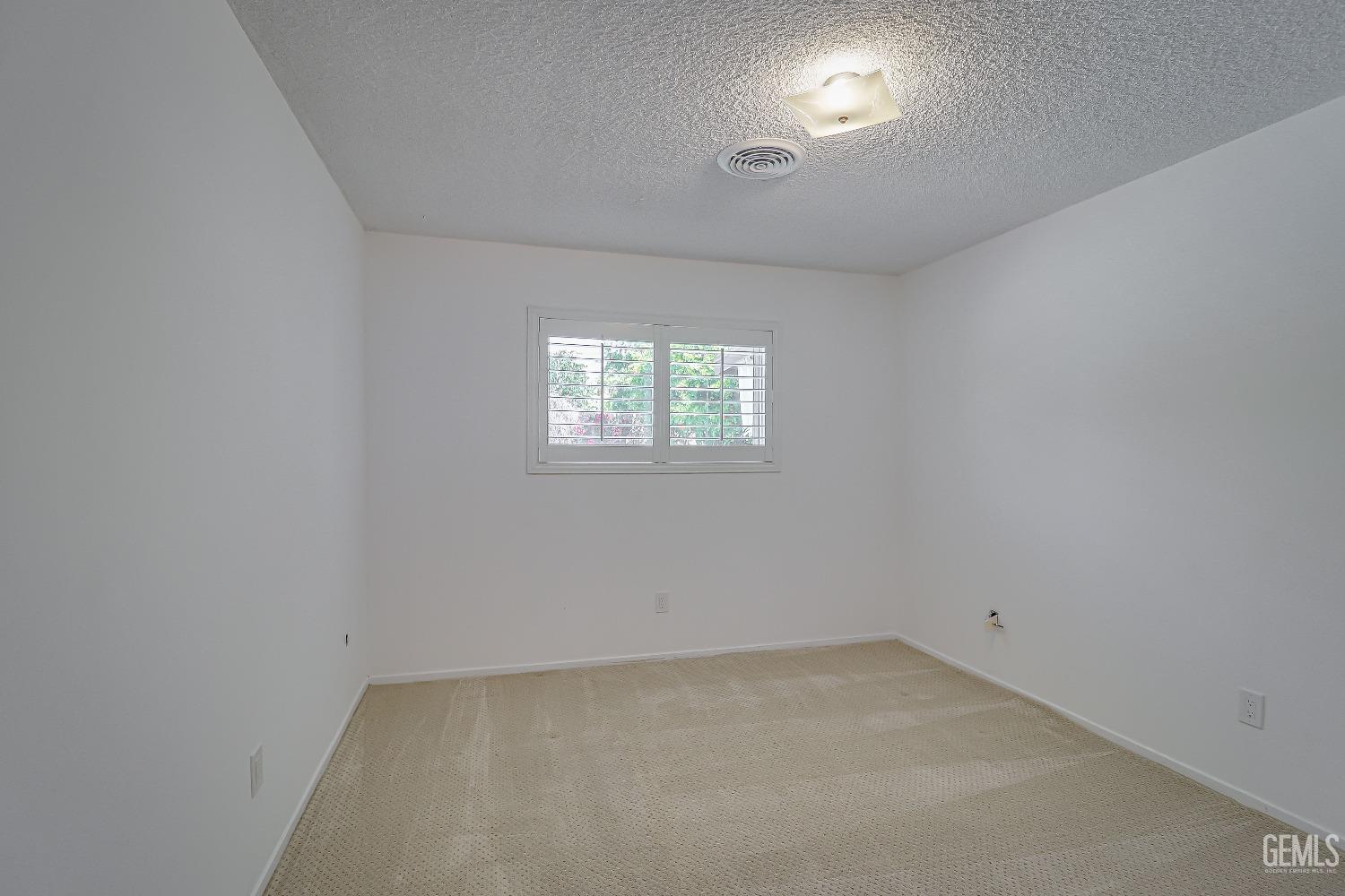 Undisclosed Address Bakersfield, CA 93309 - Photo 19 of 34 an empty room with a window