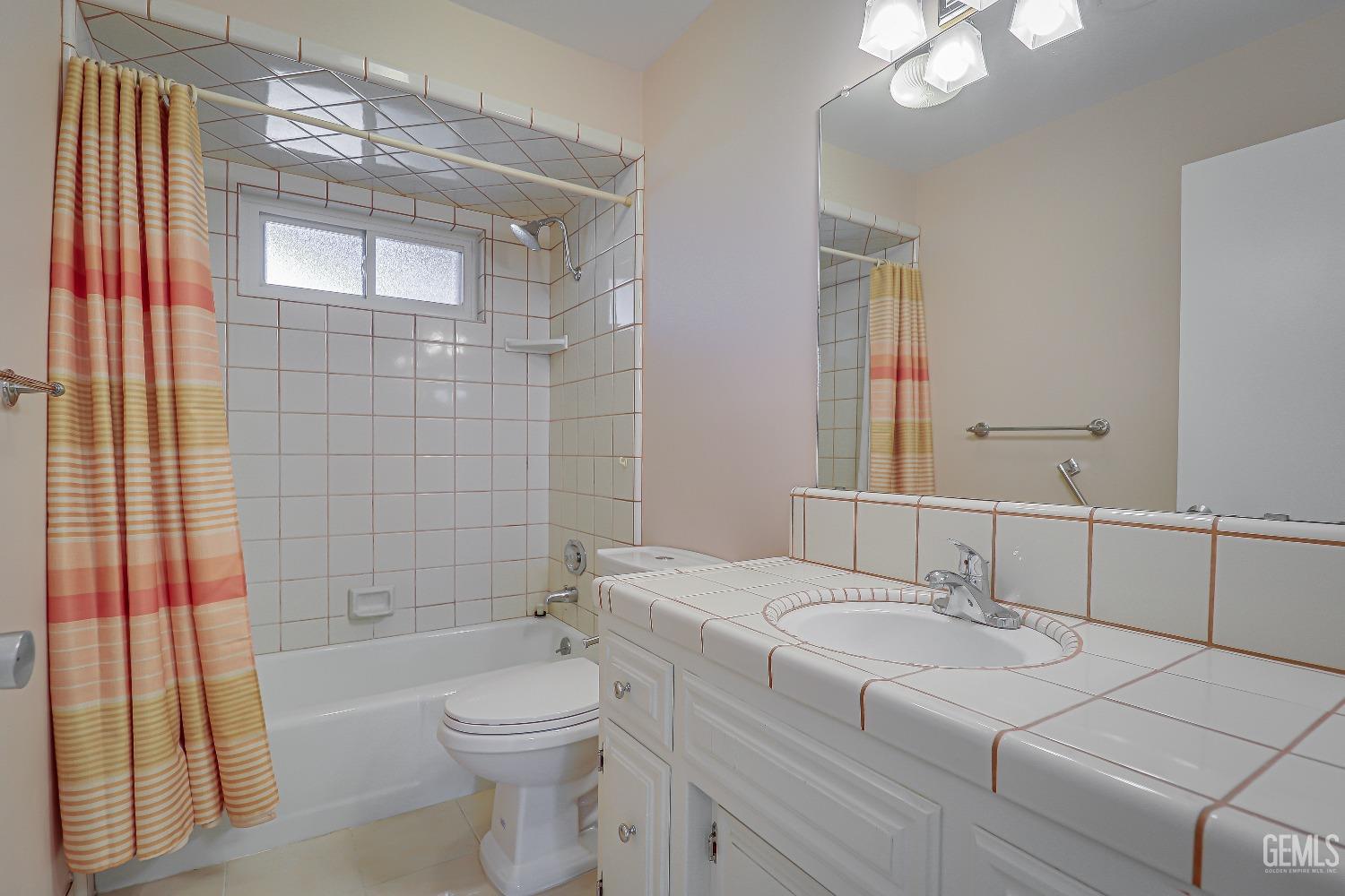 Undisclosed Address Bakersfield, CA 93309 - Photo 20 of 34 a bathroom with a sink a toilet and shower