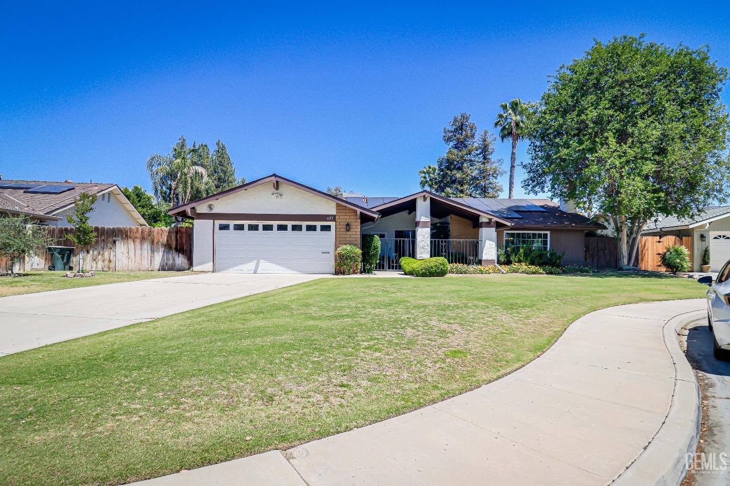 Undisclosed Address Bakersfield, CA 93309 - Photo 2 of 34 a front view of a house with a yard