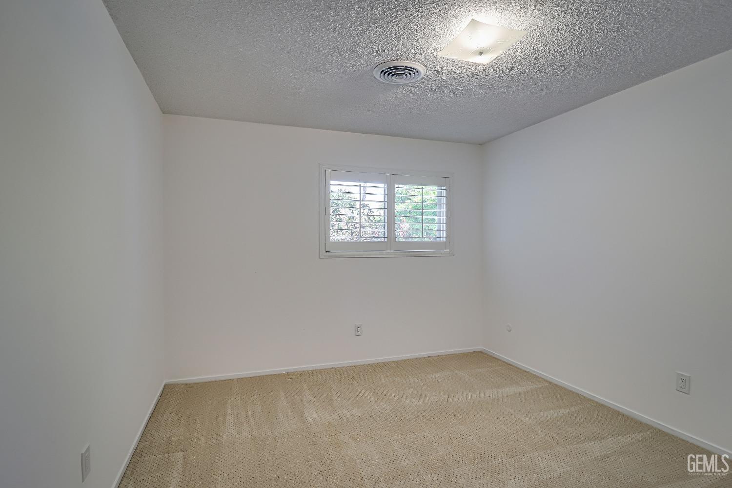 Undisclosed Address Bakersfield, CA 93309 - Photo 22 of 34 an empty room with windows