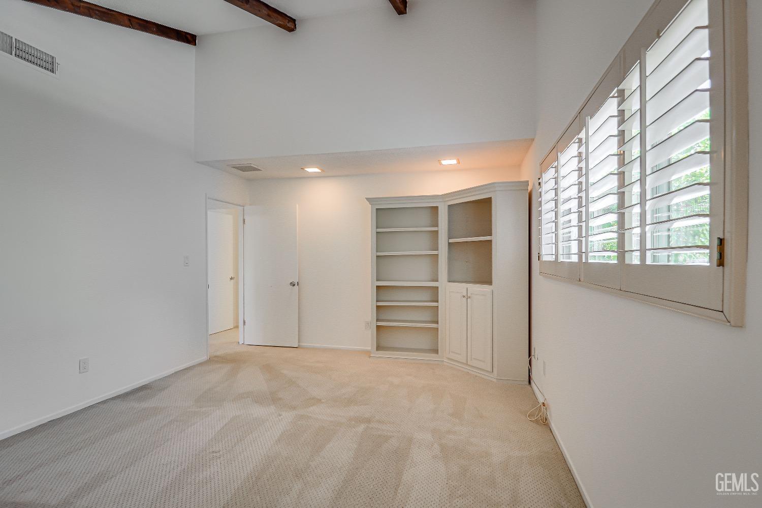 Undisclosed Address Bakersfield, CA 93309 - Photo 23 of 34 a view of a room with a closet and a window