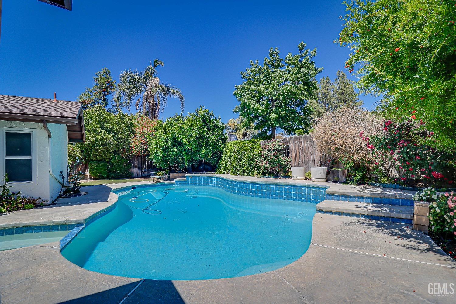 Undisclosed Address Bakersfield, CA 93309 - Photo 30 of 34 a view of a backyard with plants and a patio