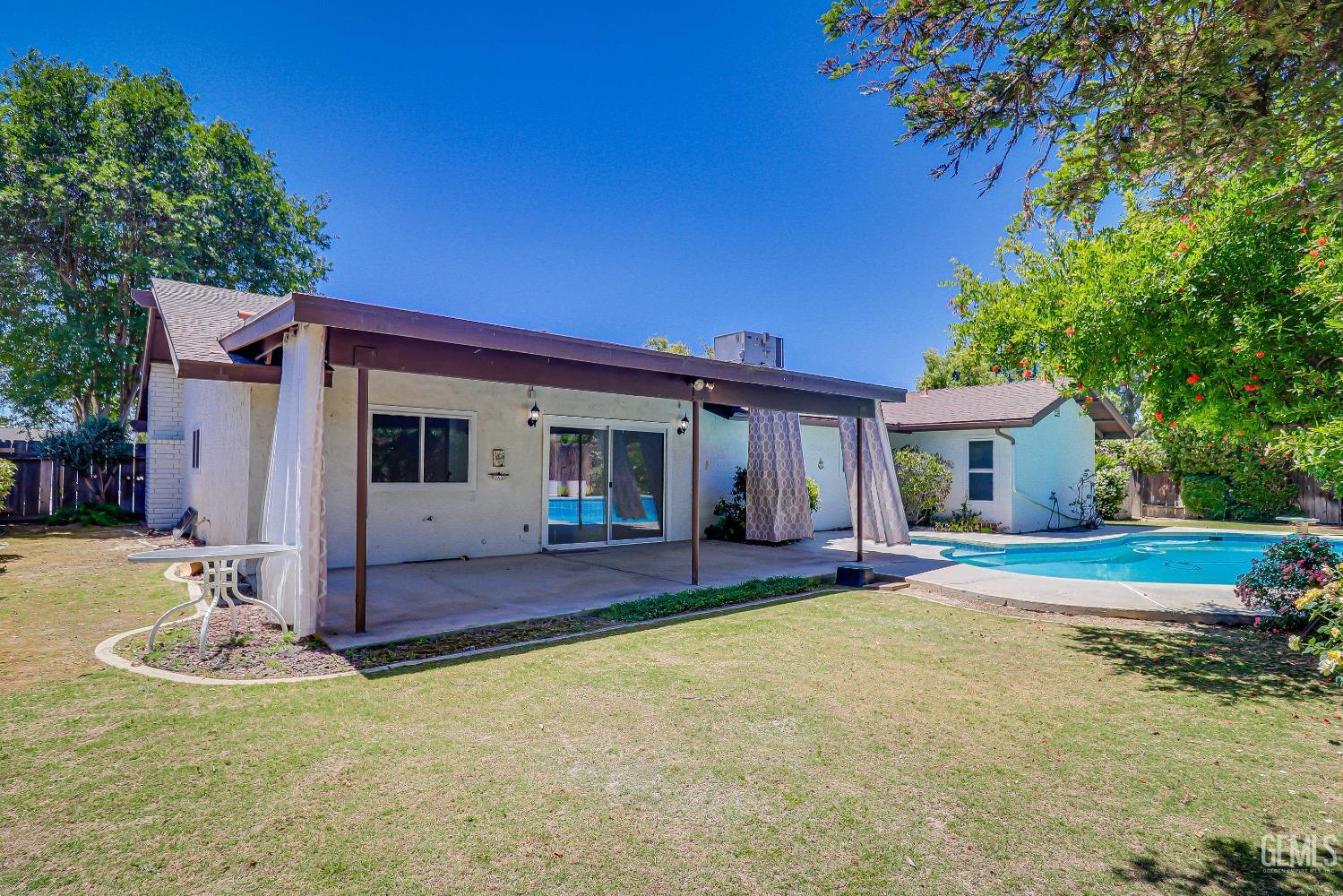 Undisclosed Address Bakersfield, CA 93309 - Photo 32 of 34 a front view of a house with a porch
