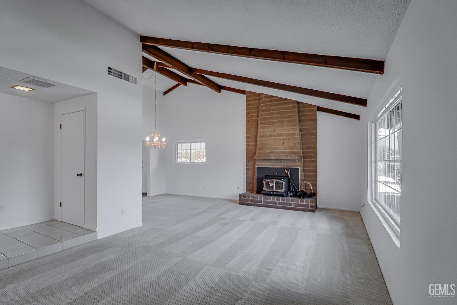 Undisclosed Address Bakersfield, CA 93309 - Photo 8 of 34 a view of a livingroom with a fireplace a window and a fireplace