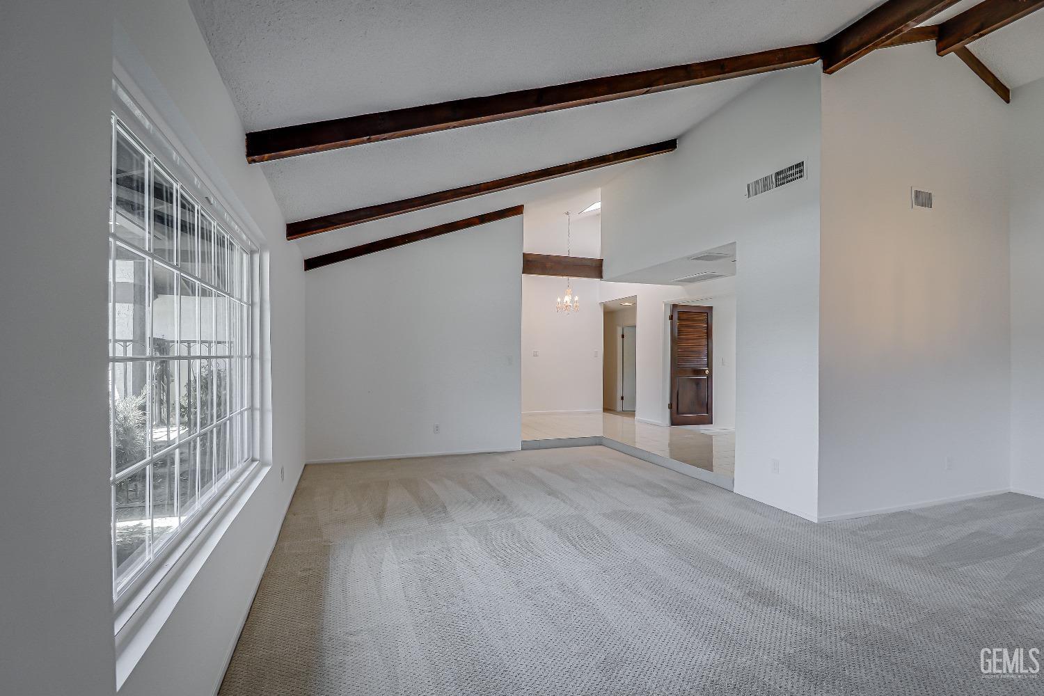 Undisclosed Address Bakersfield, CA 93309 - Photo 9 of 34 a view of hallway with wooden floor and stairs