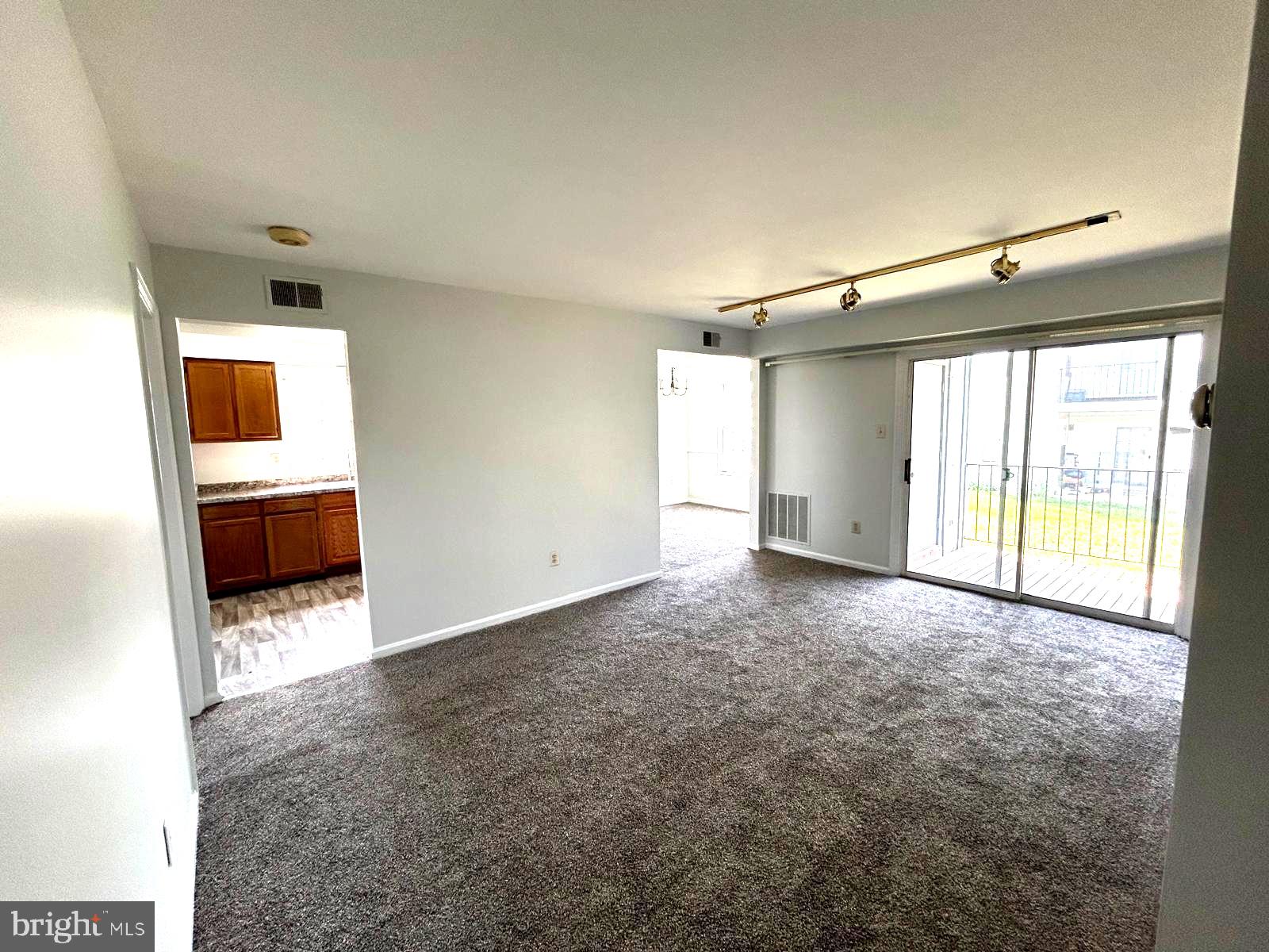 1405 Key Parkway, Unit 201A Frederick, MD 21702 - Photo 8 of 10 Spacious living area with natural light.