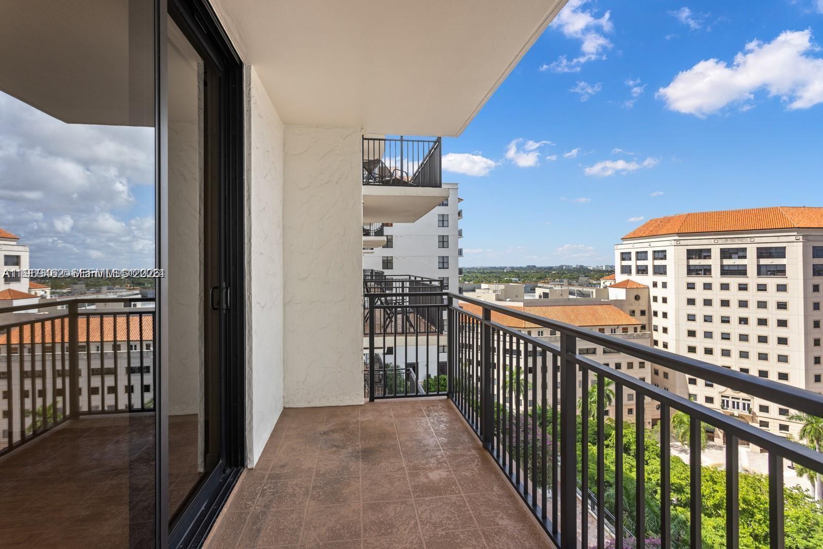 888 Douglas Road, Unit 1405 Coral Gables, FL 33134 - Photo 21 of 42 a view of a balcony with wooden floor