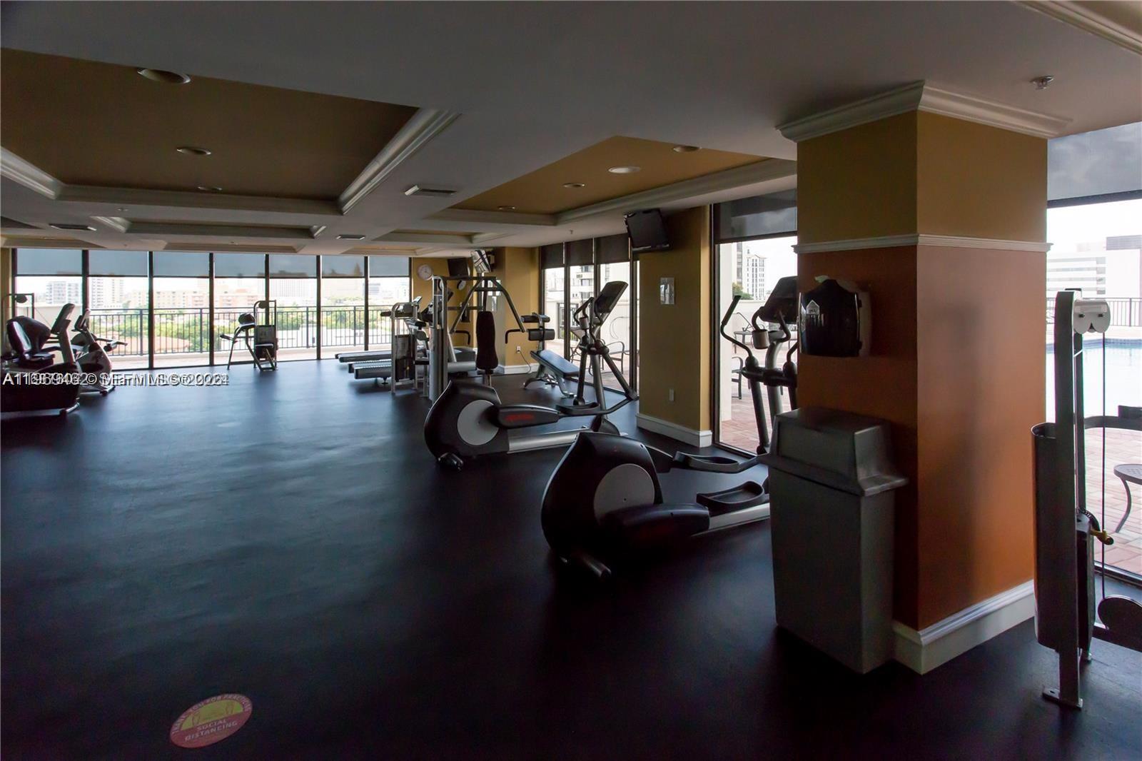 888 Douglas Road, Unit 1405 Coral Gables, FL 33134 - Photo 28 of 42 a view of a room with gym equipment