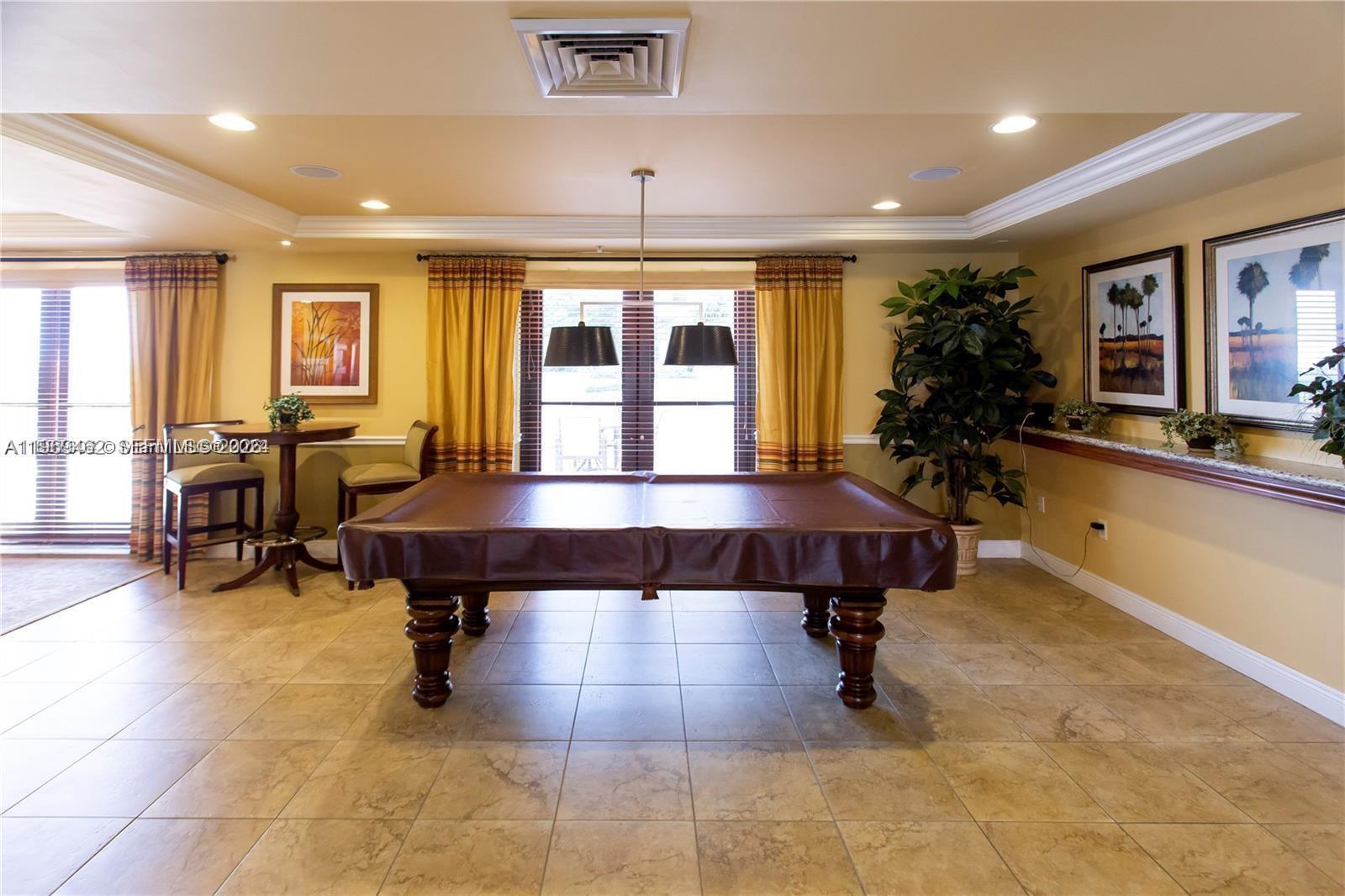 888 Douglas Road, Unit 1405 Coral Gables, FL 33134 - Photo 35 of 42 a view of a livingroom with furniture and a large window