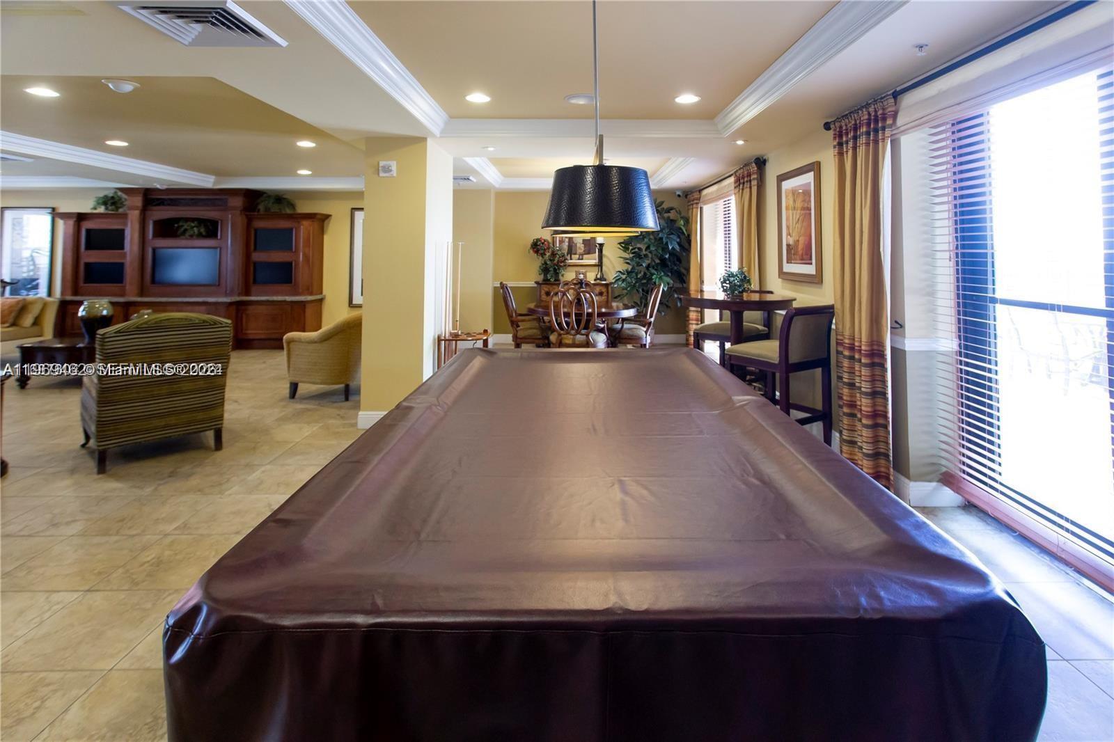 888 Douglas Road, Unit 1405 Coral Gables, FL 33134 - Photo 36 of 42 a view of a living room kitchen and a large window