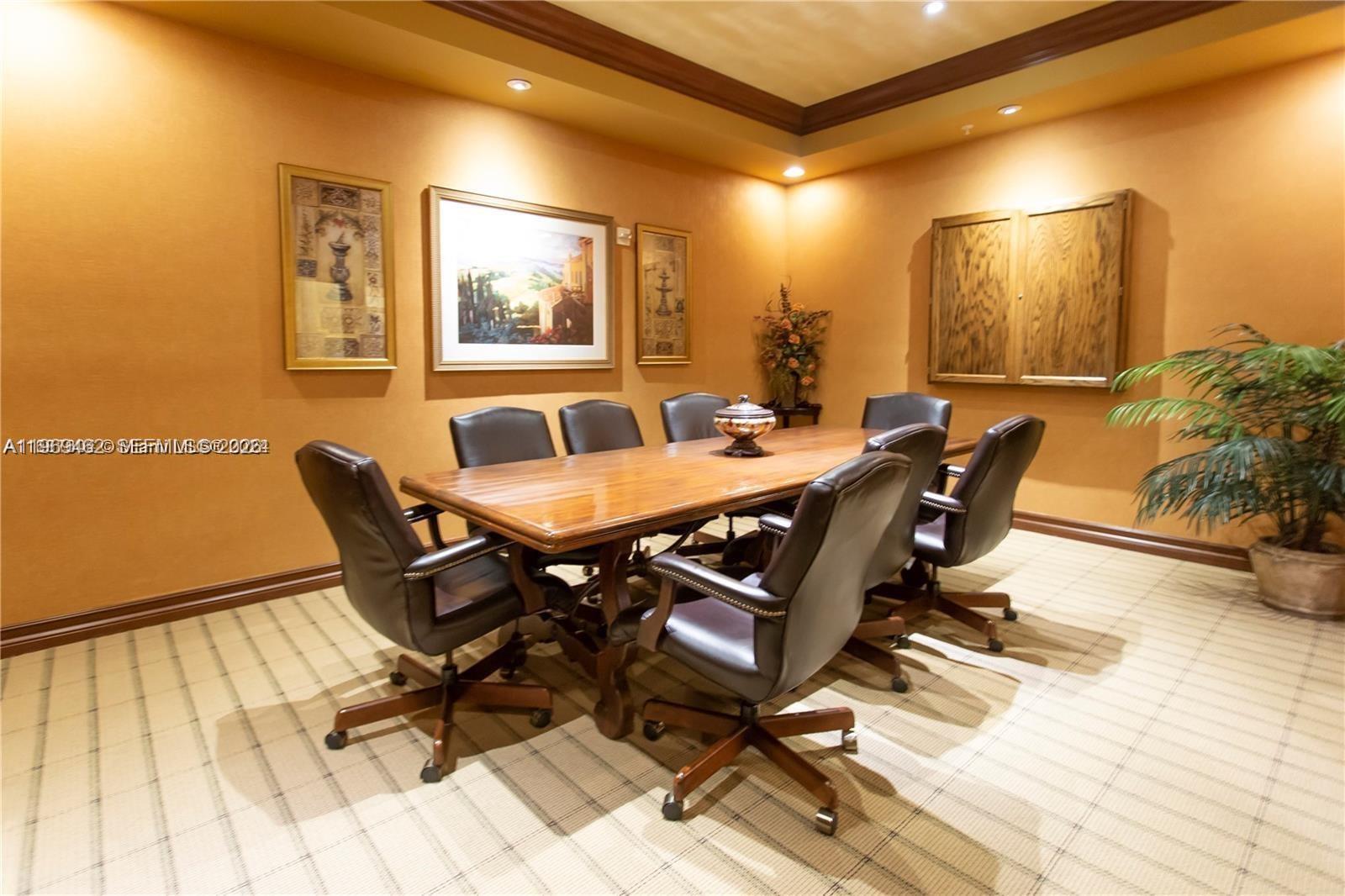 888 Douglas Road, Unit 1405 Coral Gables, FL 33134 - Photo 40 of 42 a view of a dining room with a table and chairs