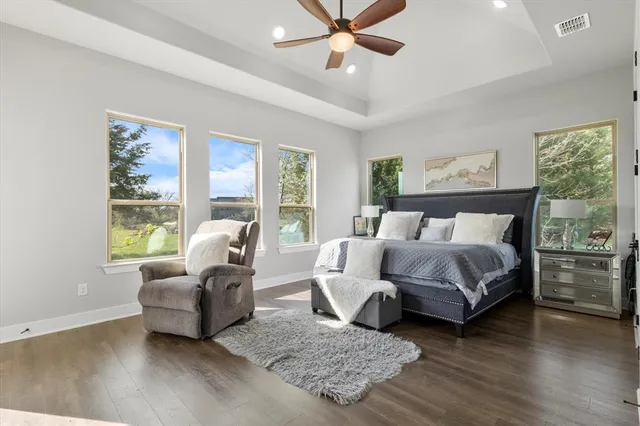 a bedroom with a bed and a tv