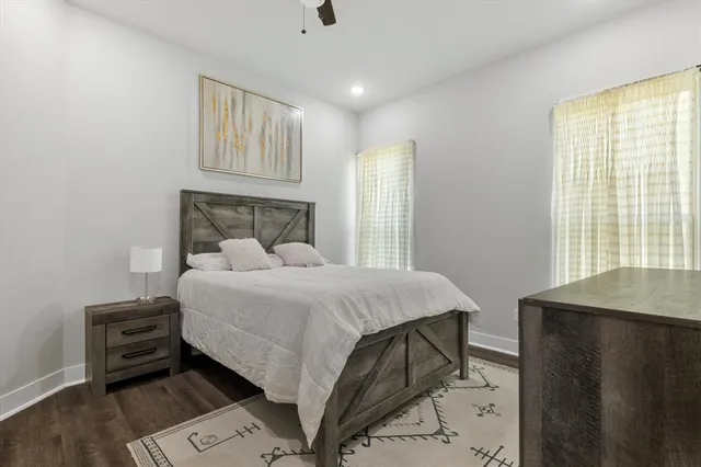 a bathroom with a double vanity sink toilet and shower