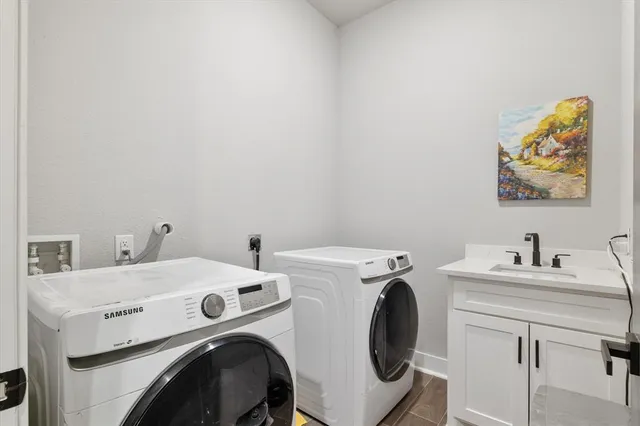 a front view of a house with a yard table and chairs