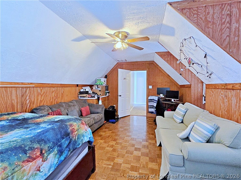 5218 Pringle Way Hope Mills, NC 28348 - Photo 18 of 43 a bedroom with a bed ceiling fan and a rug