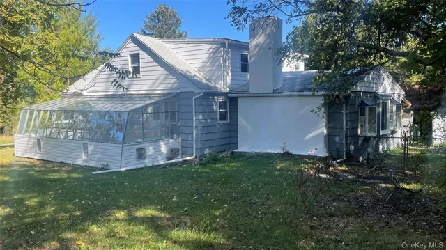 a view of a back yard of the house