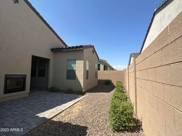 a house view with a backyard space