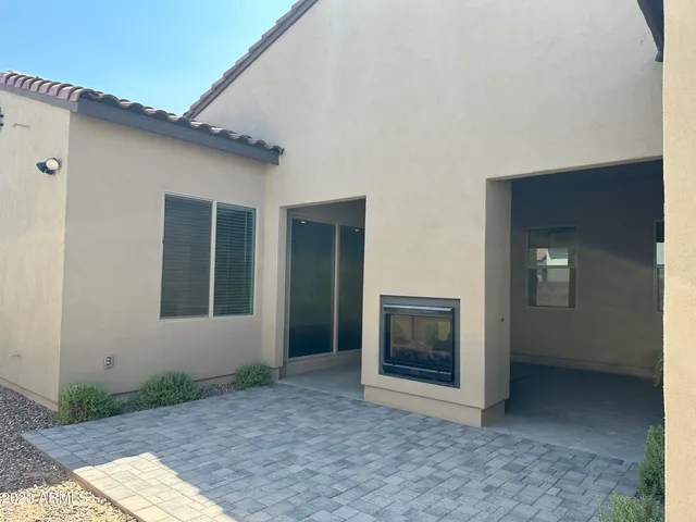 a view of an front door and yard