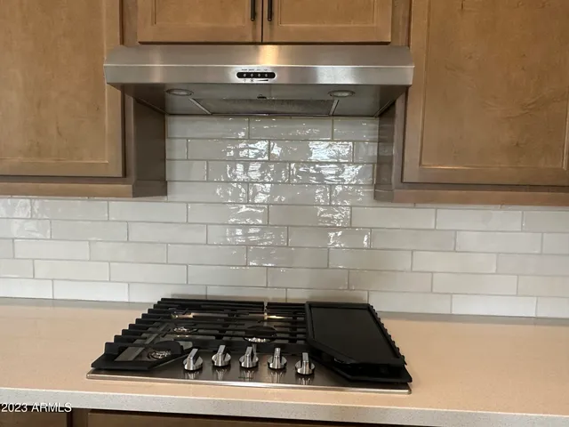 a close view of a stove a microwave and oven