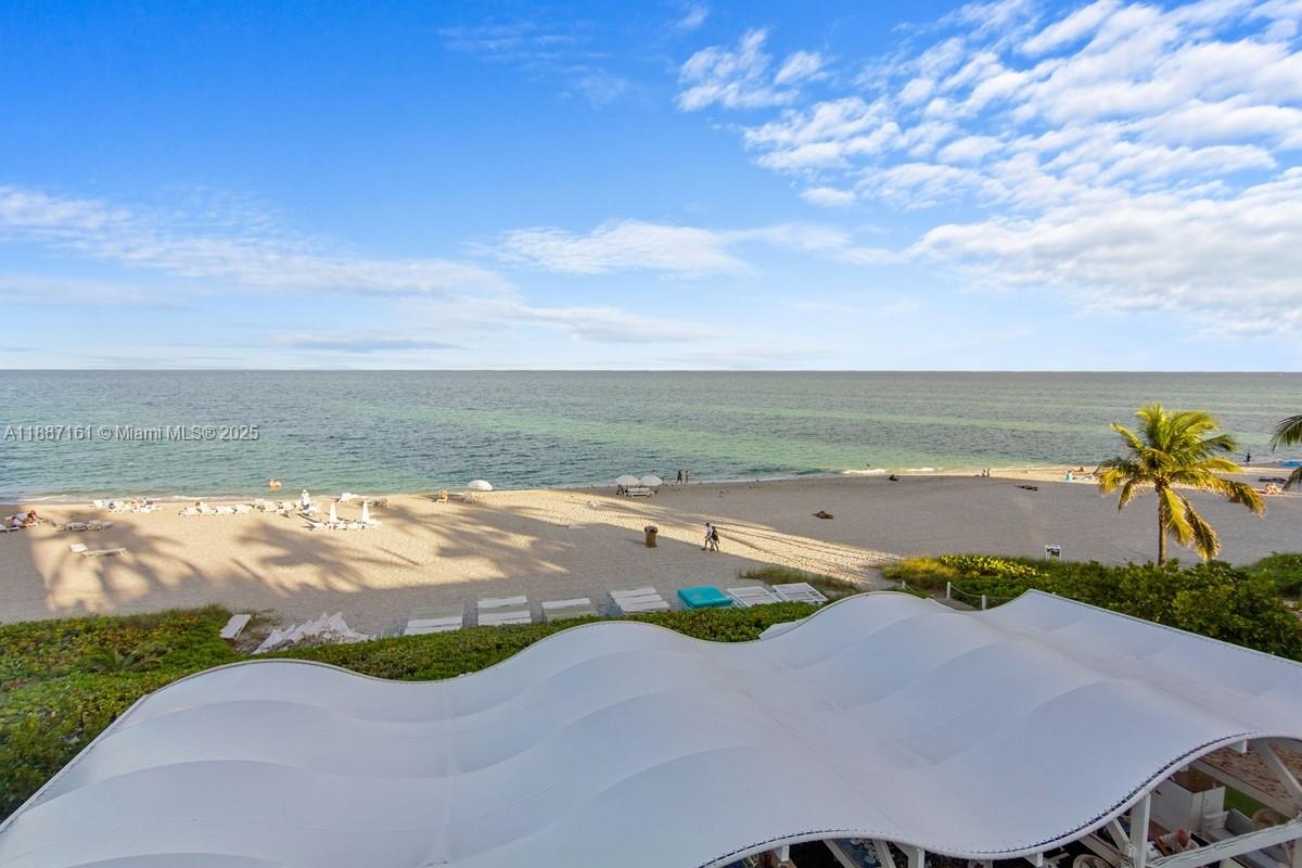 18001 Collins Avenue, Unit 2209 Sunny Isles Beach, FL 33160 - Photo 22 of 27 a view of an ocean and beach