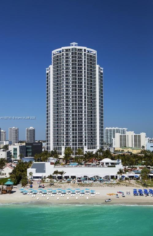18001 Collins Avenue, Unit 2209 Sunny Isles Beach, FL 33160 - Photo 3 of 27 a front view of a building with swimming pool
