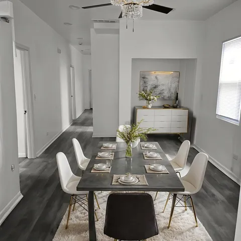 a view of a dining room with furniture and window