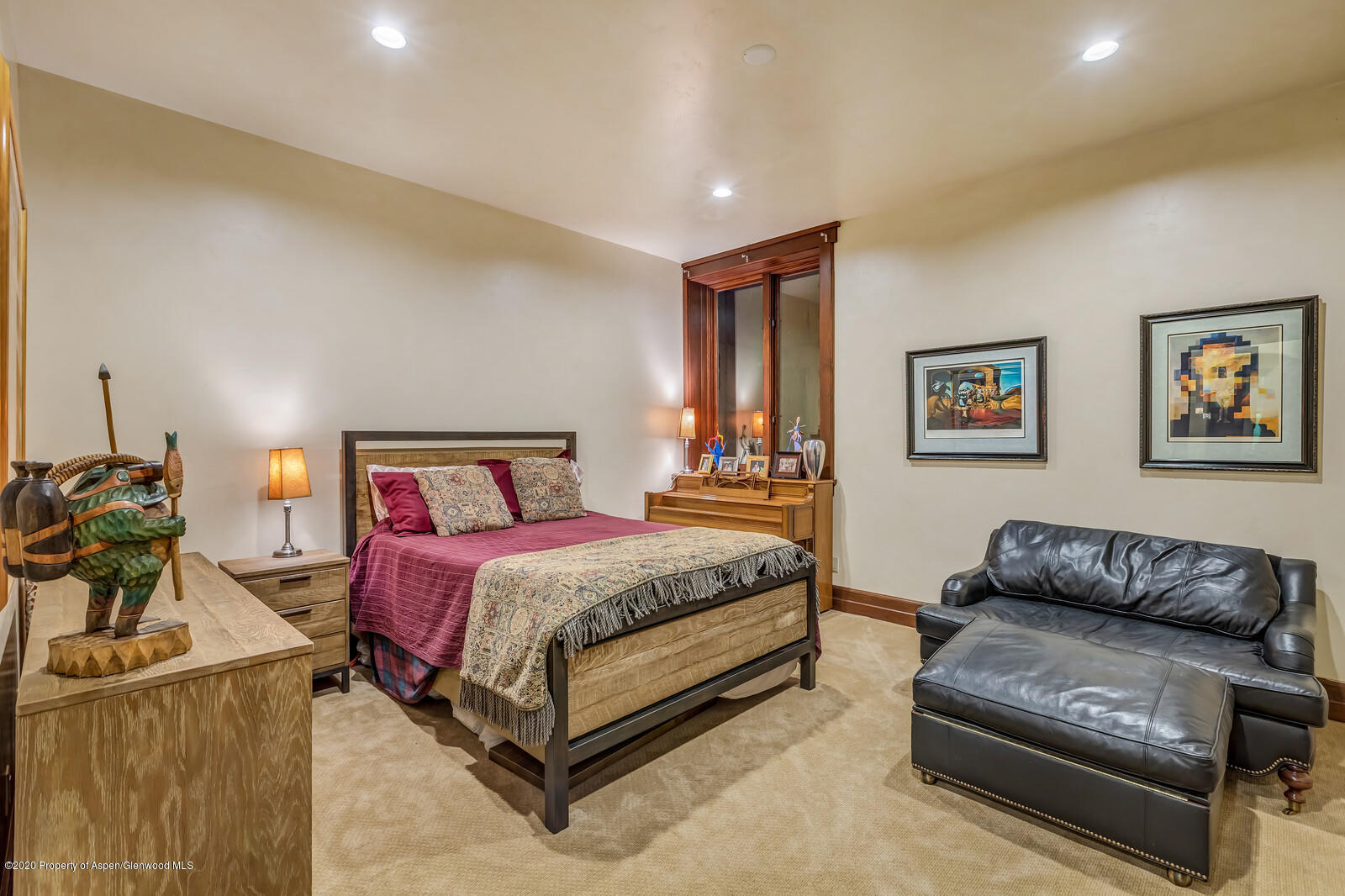 160 Red Rock Road Basalt, CO 81621 - Photo 18 of 45 a spacious bedroom with a bed and a couch