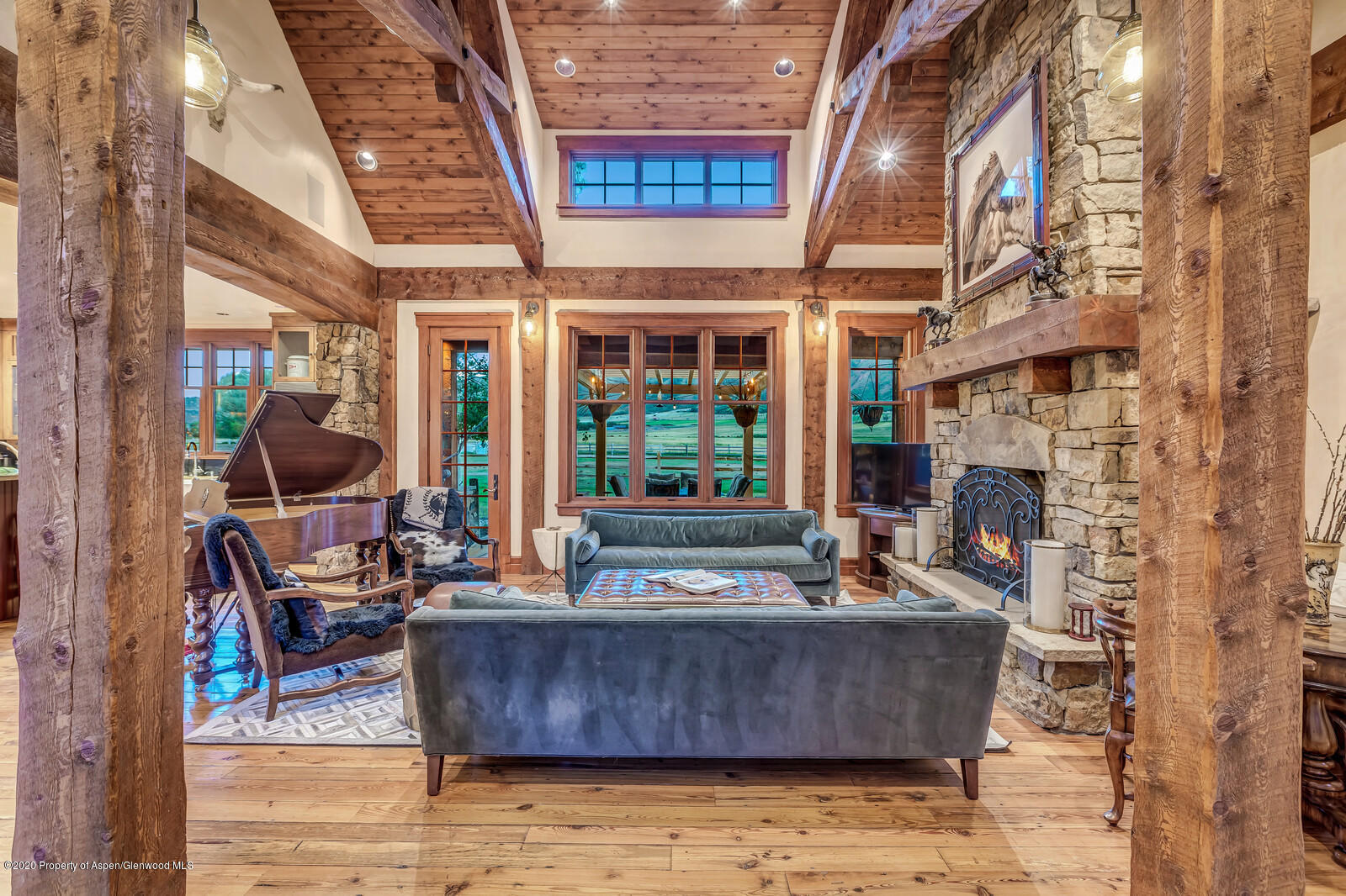 160 Red Rock Road Basalt, CO 81621 - Photo 3 of 45 a living room with fireplace furniture and a floor to ceiling window