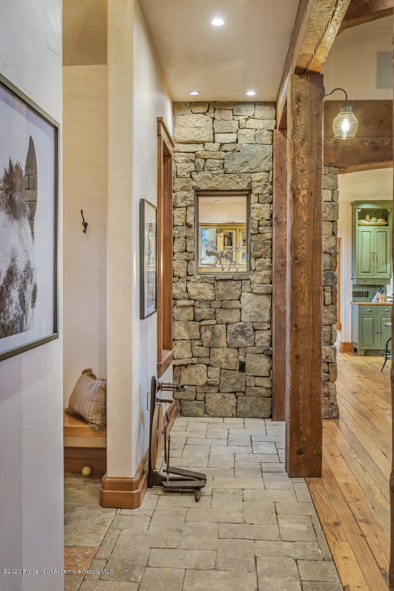 160 Red Rock Road Basalt, CO 81621 - Photo 7 of 45 a view of a hallway with wooden walls