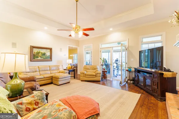a open kitchen with stainless steel appliances granite countertop a sink and dishwasher a stove with wooden floor
