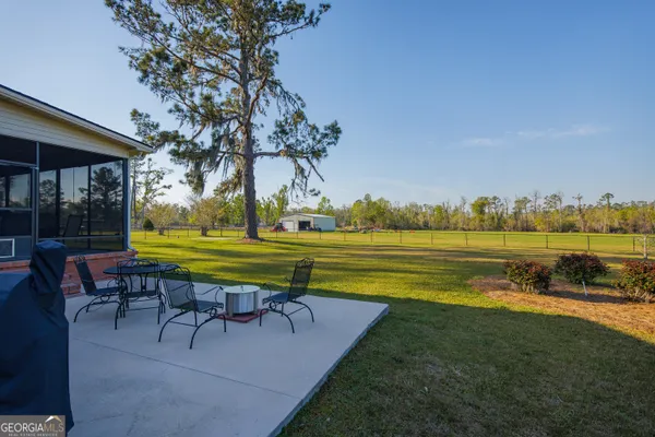 a view of a lake with a big yard