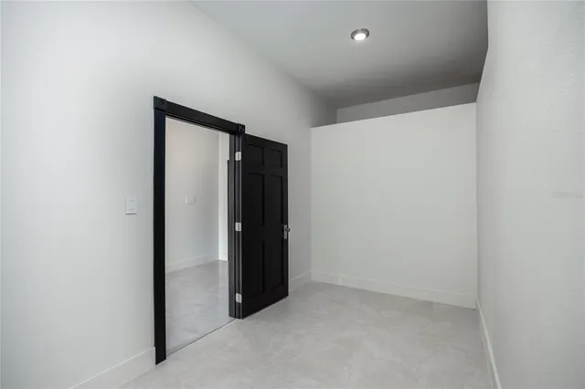 a kitchen with granite countertop a sink stainless steel appliances and cabinets