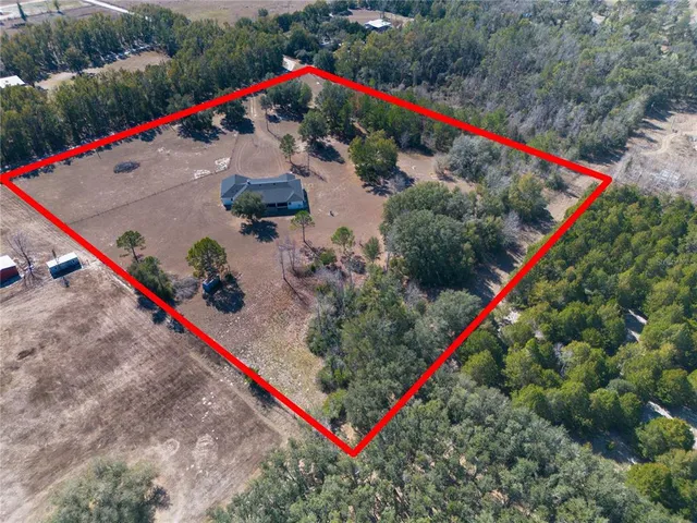 an empty room with closet and fan