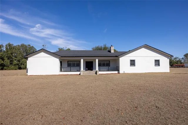 a spacious bathroom with a bathtub shower and sink