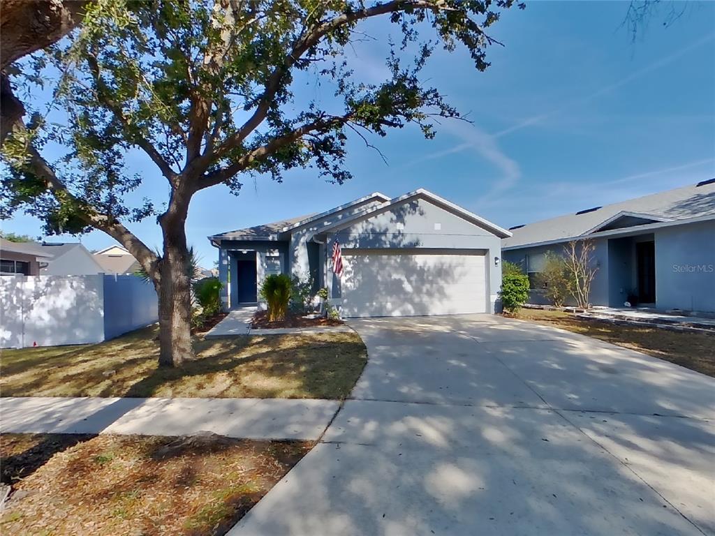 Undisclosed Address Riverview, FL 33578 - Photo 1 of 15 a view of a house with a patio and a yard