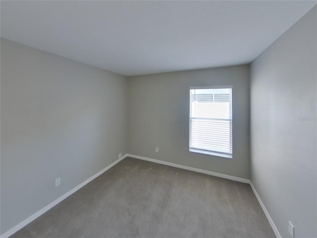 Undisclosed Address Riverview, FL 33578 - Photo 12 of 15 an empty room with a window