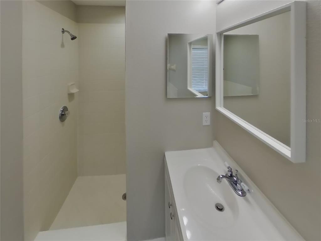 Undisclosed Address Riverview, FL 33578 - Photo 7 of 15 a bathroom with a sink and mirror