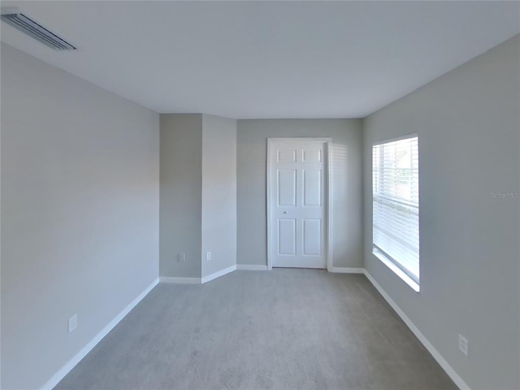Undisclosed Address Riverview, FL 33578 - Photo 9 of 15 a view of an empty room with a window