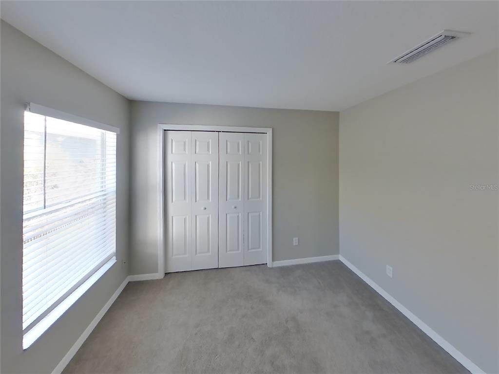 Undisclosed Address Riverview, FL 33578 - Photo 10 of 15 a view of an empty room with a window