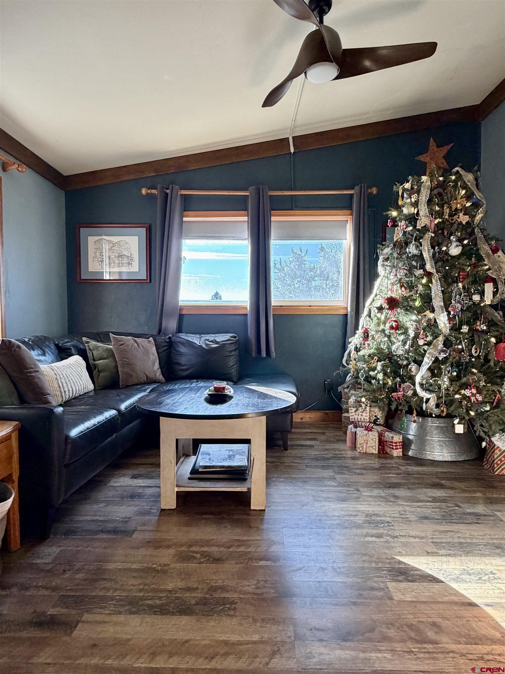18377 Highway 65 Cedaredge, CO 81413 - Photo 12 of 45 a living room with furniture and a large window