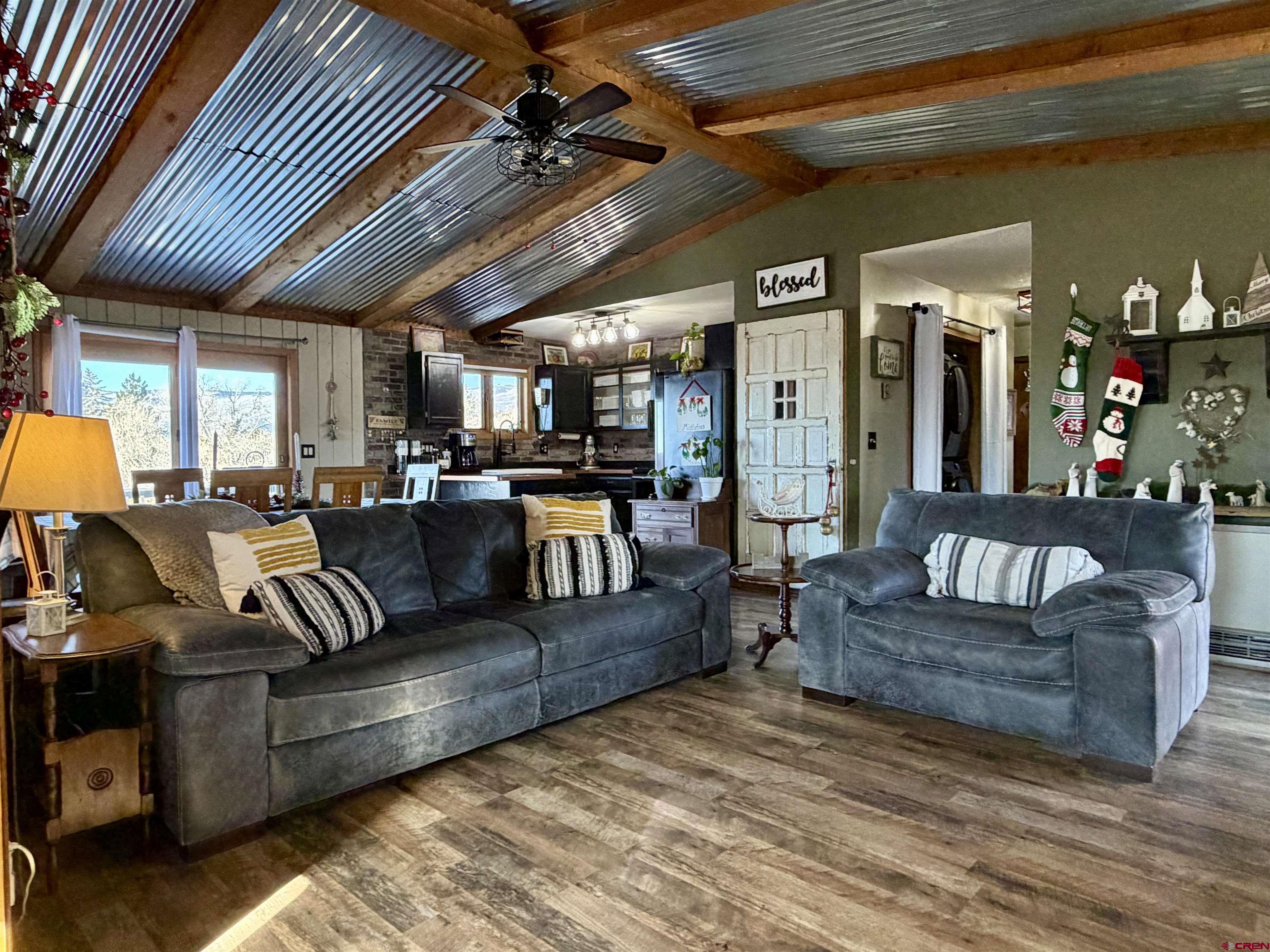 18377 Highway 65 Cedaredge, CO 81413 - Photo 13 of 45 a living room with furniture and wooden floors